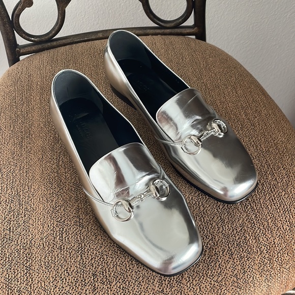 Gucci Shoes - Price firm. Gucci Lillian slip on authentic sliver loafers size 38 NWOT.